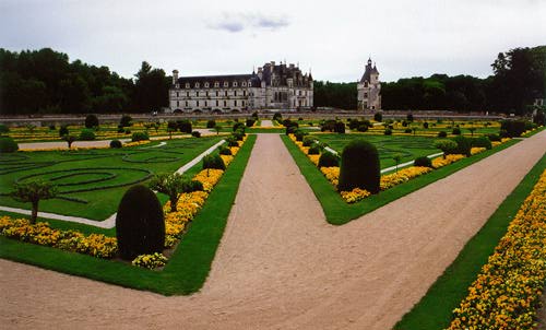 Enormous garden with yellow flowers and a big chateau in
the distance