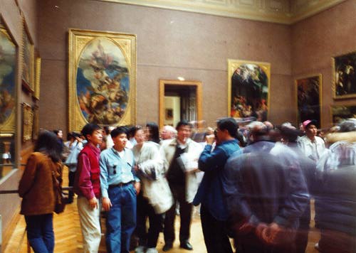 Tourists surrounded by art